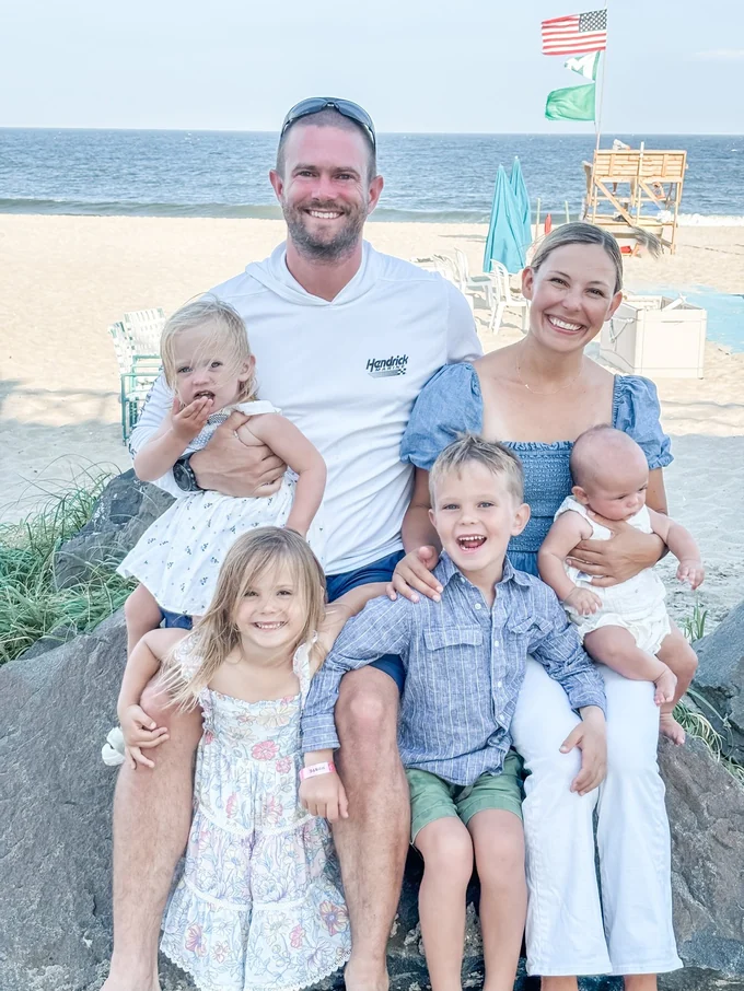Tim Johnson with his wife and four kids at the beach